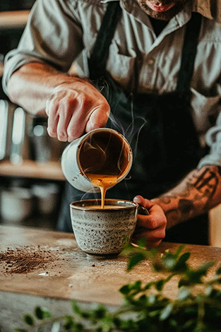 raw image Barista coffee into a cup
