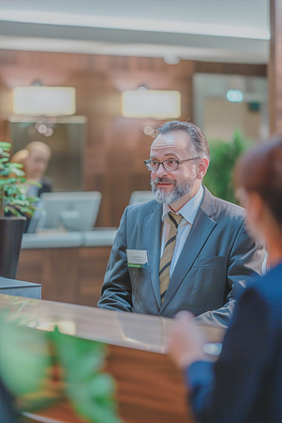raw image snapshot of a hotel receptionist