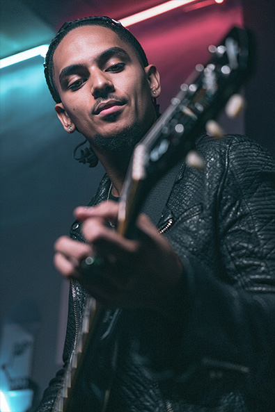 Before candid photograph of a musician performing on stage