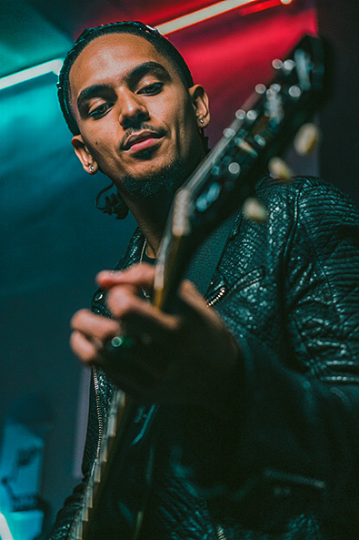 After candid photograph of a musician performing on stage