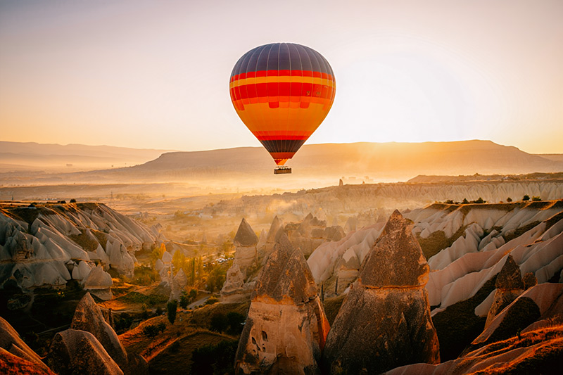 After hot air balloon above the distinctive rock formations of Cappadocia, Turkey