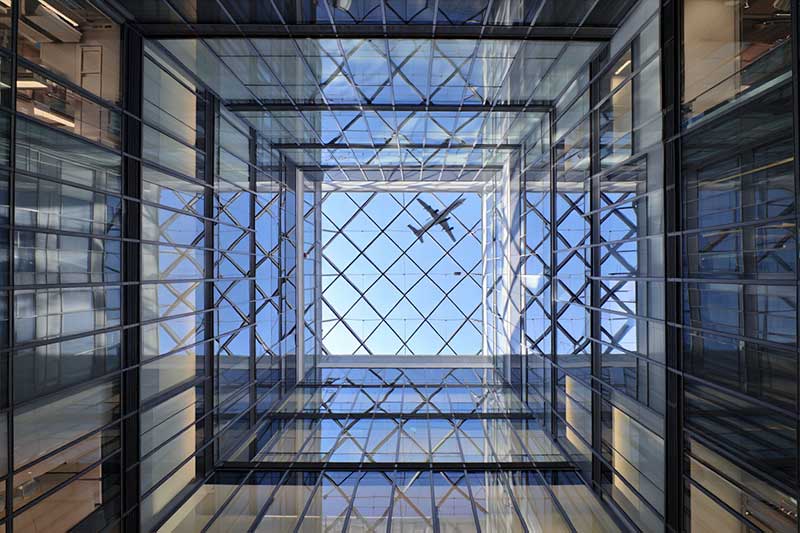 Before shopping mall's geometric glass ceiling
