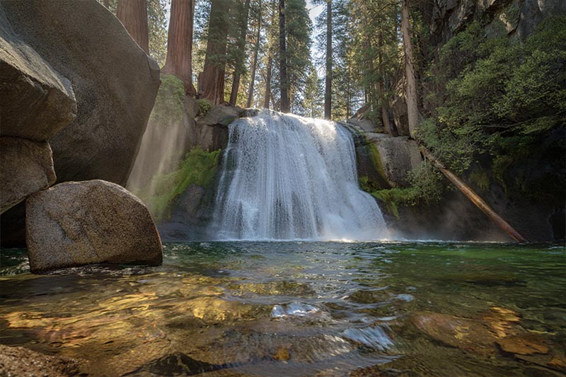 Before waterfall in Yosemite National Park, California, shows cascading white water dropping into a crystal-clear pool below