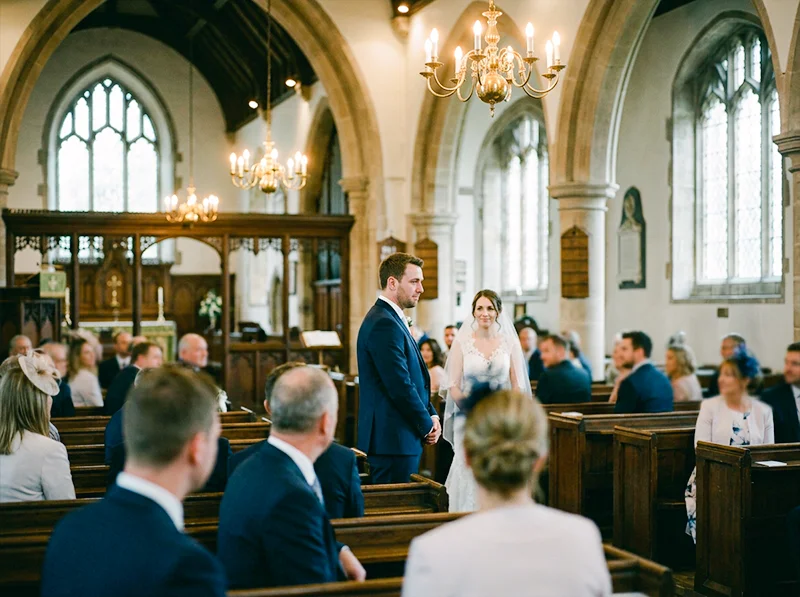 Wedding ceremony candid shot showing Fujifilm Pro 400H color rendering in mixed tungsten and daylight